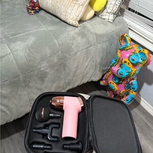 Compact Pink Massage Gun with Attachments